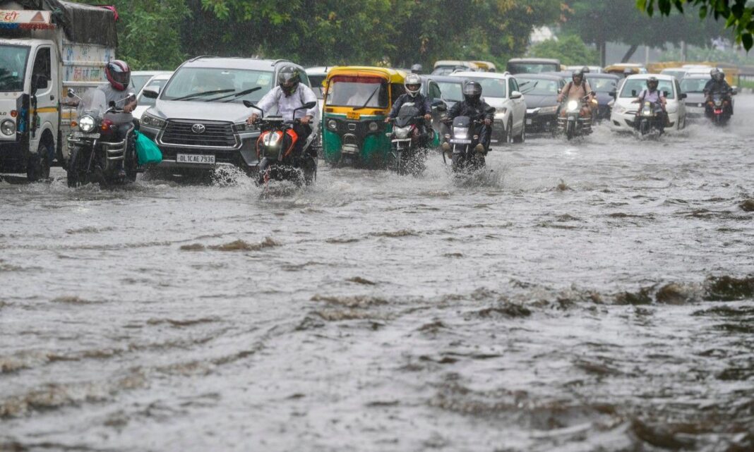 Delhi NCR Heavy Rain Causes Flooding Traffic Chaos And IMD Warning