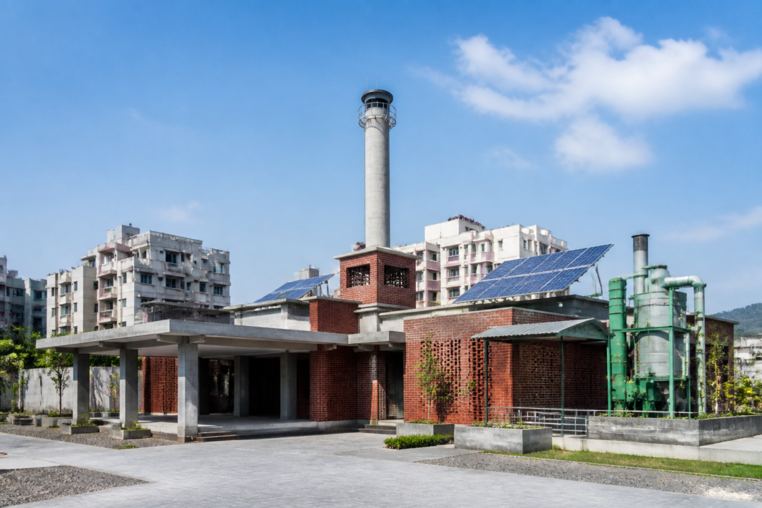 Crematorium infrastructure in Vasai-Virar illustrating the proposed eco-friendly gasification system and chimney