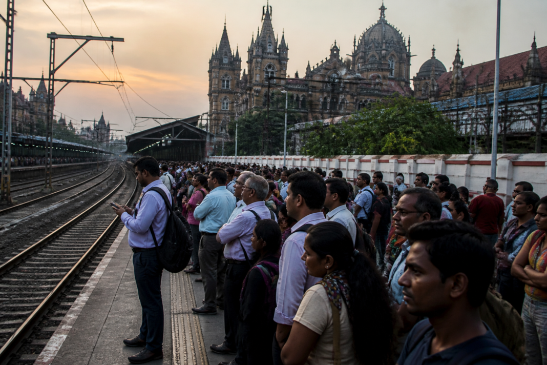 Crowded Mumbai local train platform during Central Railway delays near CSMT