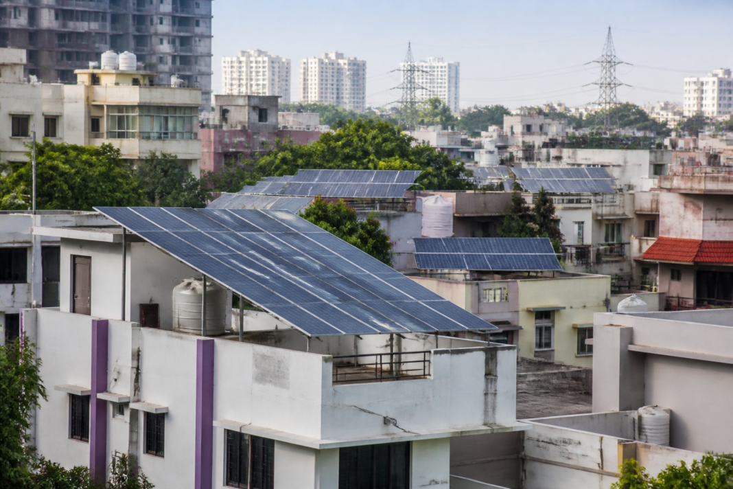Residential rooftop solar panels installed on urban homes in India