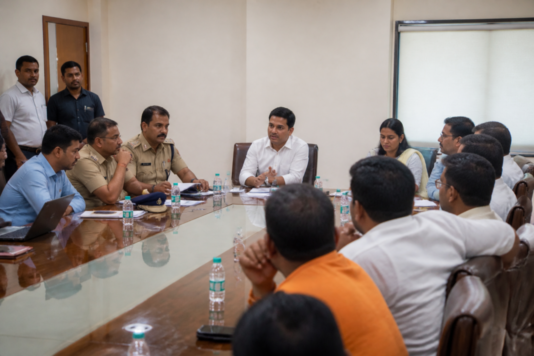 Police and municipal officials reviewing Vasai-Virar Ganeshotsav safety and sound pollution arrangements at a meeting