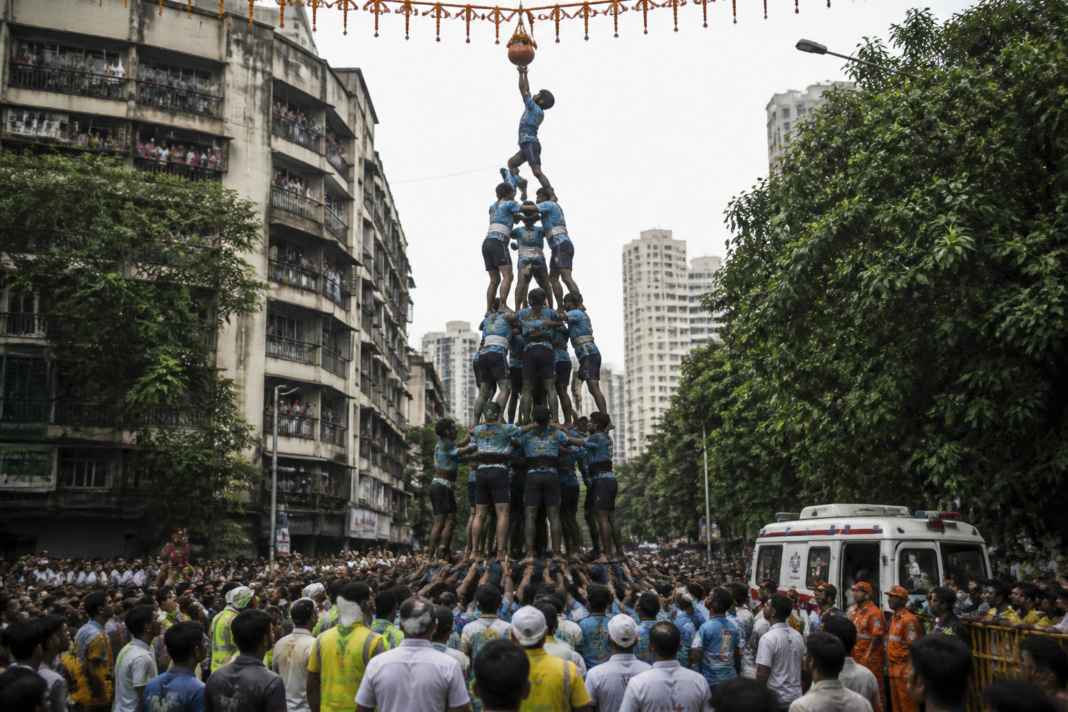 Govindas taking part in a Dahi Handi celebration in Mumbai as hospitals prepare to treat festival-related injuries