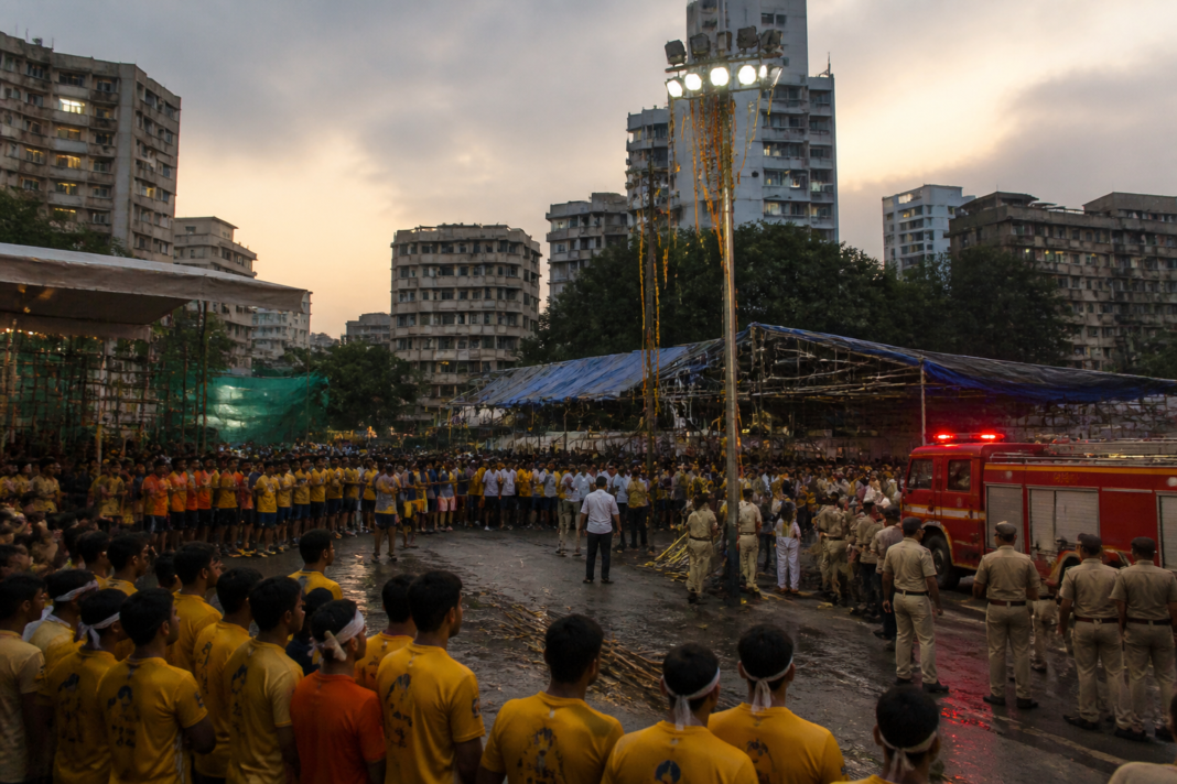 Dahi Handi Govinda teams forming a human pyramid during a Mumbai festival event