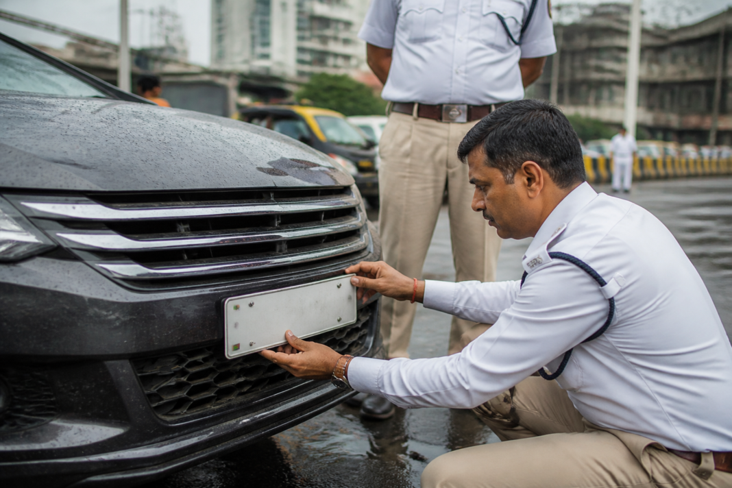 HSRP number plate inspection during a vehicle enforcement drive in Mumbai