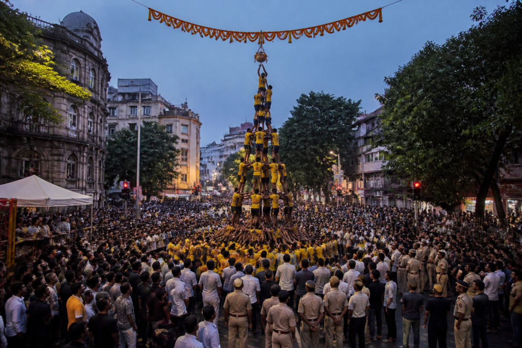 Dahi Handi festival decorations and crowd management on a Pune street during noise pollution restrictions