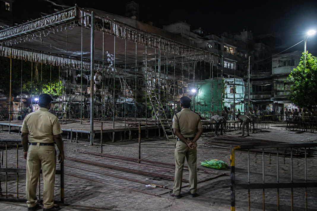 Temporary Dahi Handi stage structure being dismantled in a Pimpri-Chinchwad neighbourhood