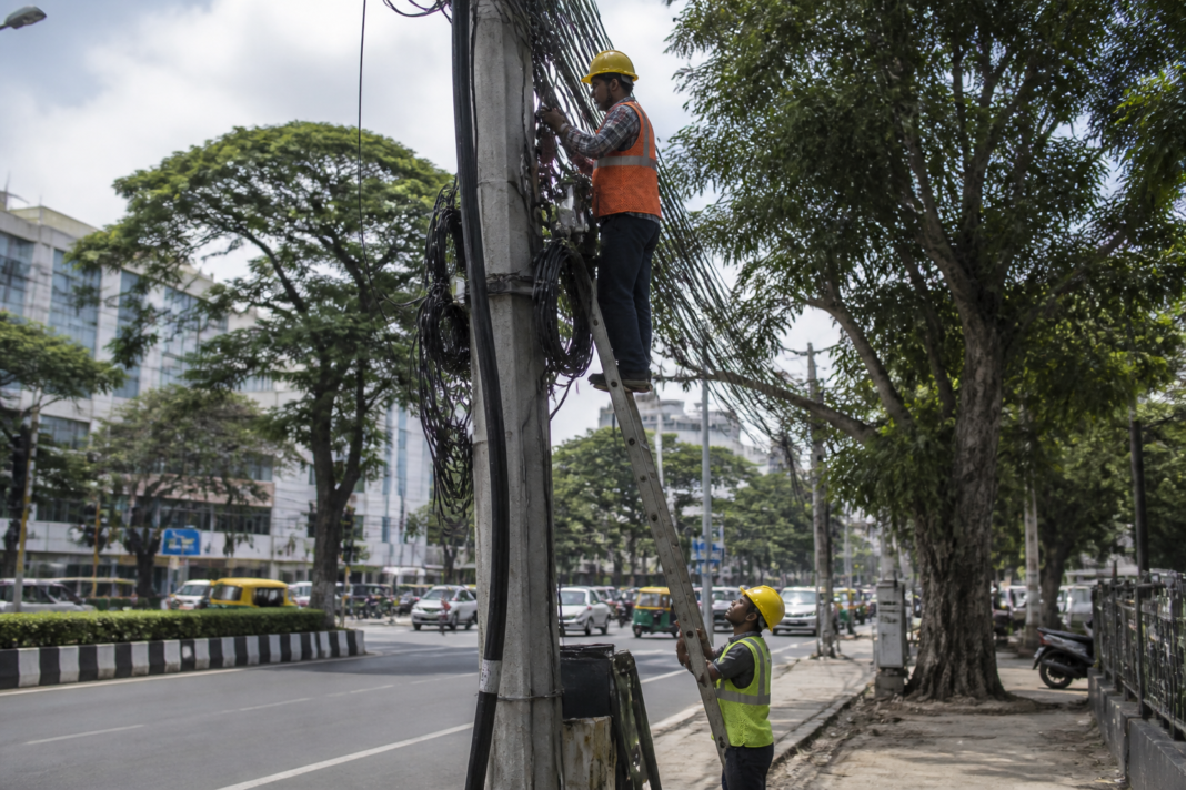 Electricity poles along Ballari Road near Palace Guttahalli Junction in Bengaluru