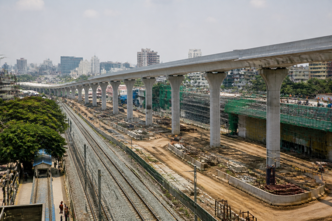 Construction work on Bengaluru's suburban railway corridor near Yeshwanthpur, showing elevated rail infrastructure and an urban transport setting