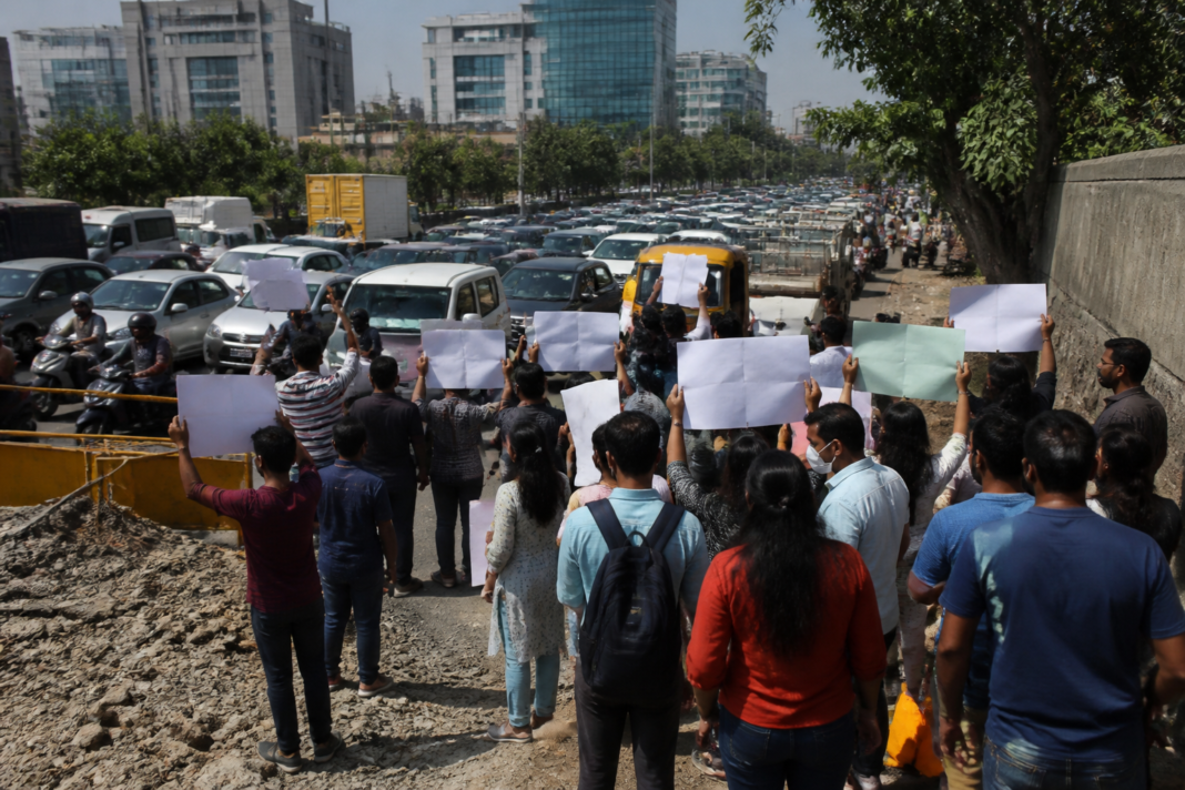 IT employees and residents march during a protest over Hinjawadi infrastructure and traffic congestion in Pune