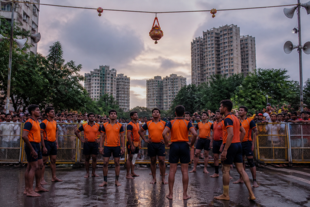 Govinda participants forming a human pyramid at a Dahi Handi event in Airoli, Navi Mumbai