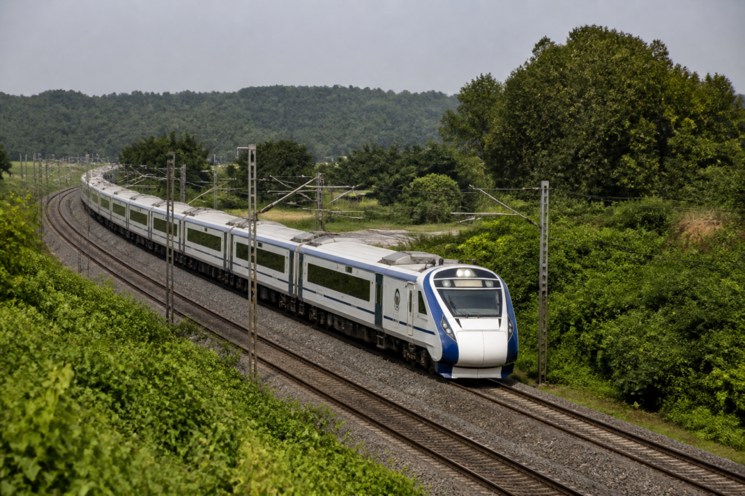 White-and-blue 16-car Vande Bharat train during a trial run on the Yesvantpur-Mangaluru railway route