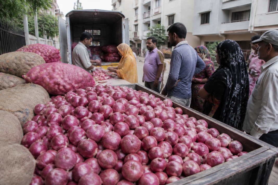 Government buffer onions being distributed through a retail outlet in an Indian city