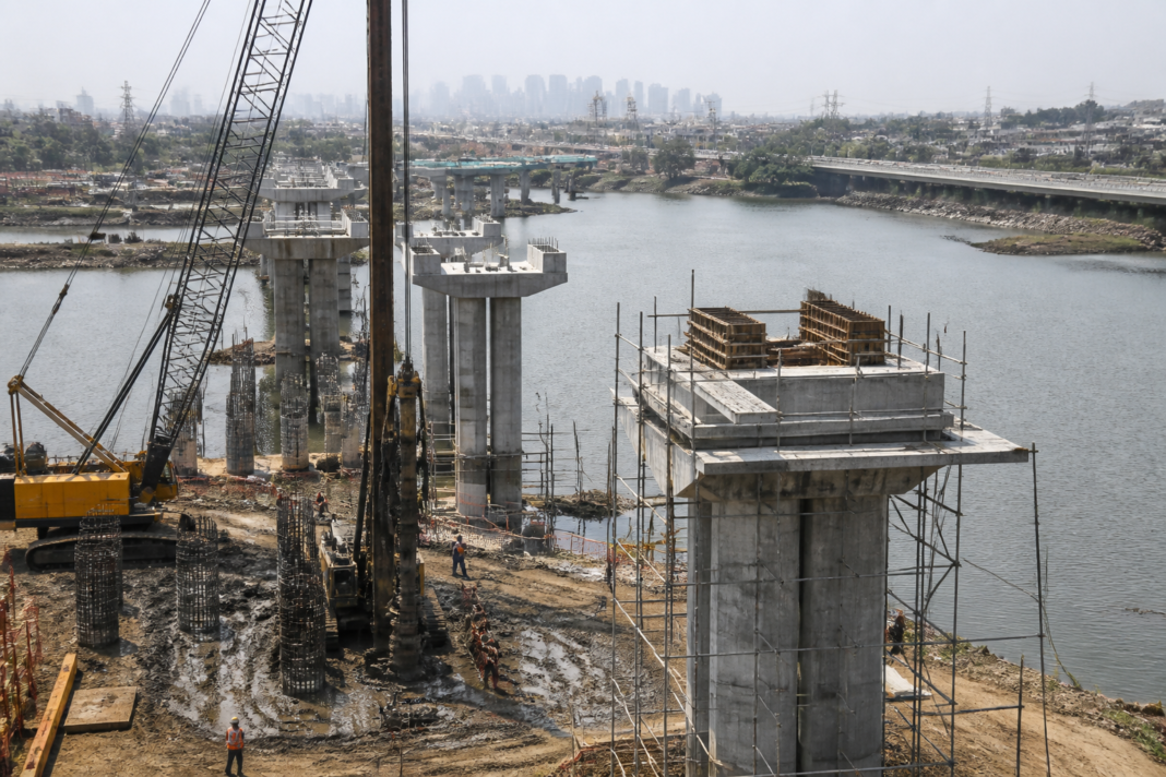 Construction activity on the Gaimukh-Payegaon Bridge project across the Thane creek in Maharashtra