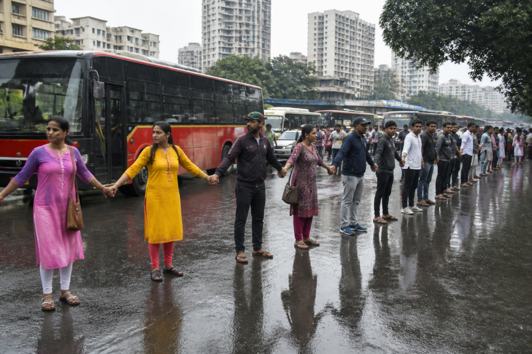 Residents forming a protest human chain in Thane over the proposed Thane Ring Metro project