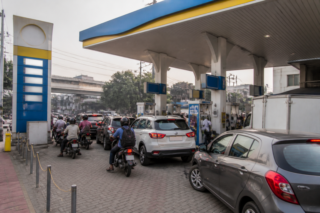 Fuel station in an Indian city displaying petrol and diesel prices as crude oil costs rise