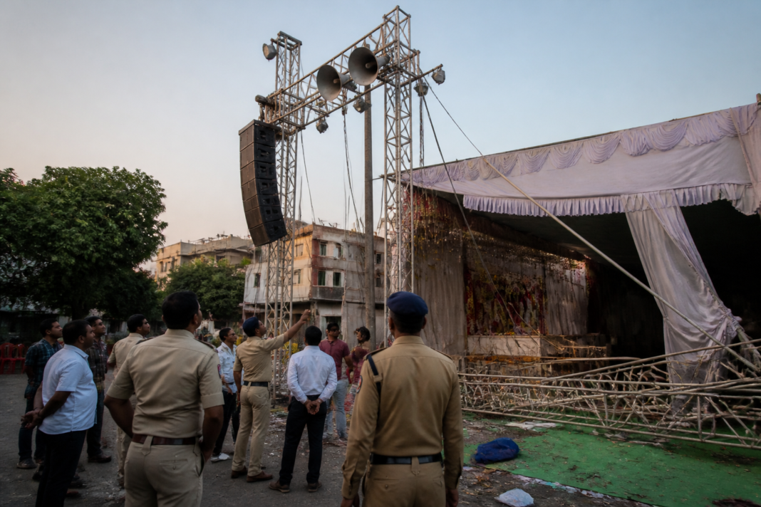 Temporary event sound equipment and metal support structures at a neighbourhood Dahihandi venue in Sangvi