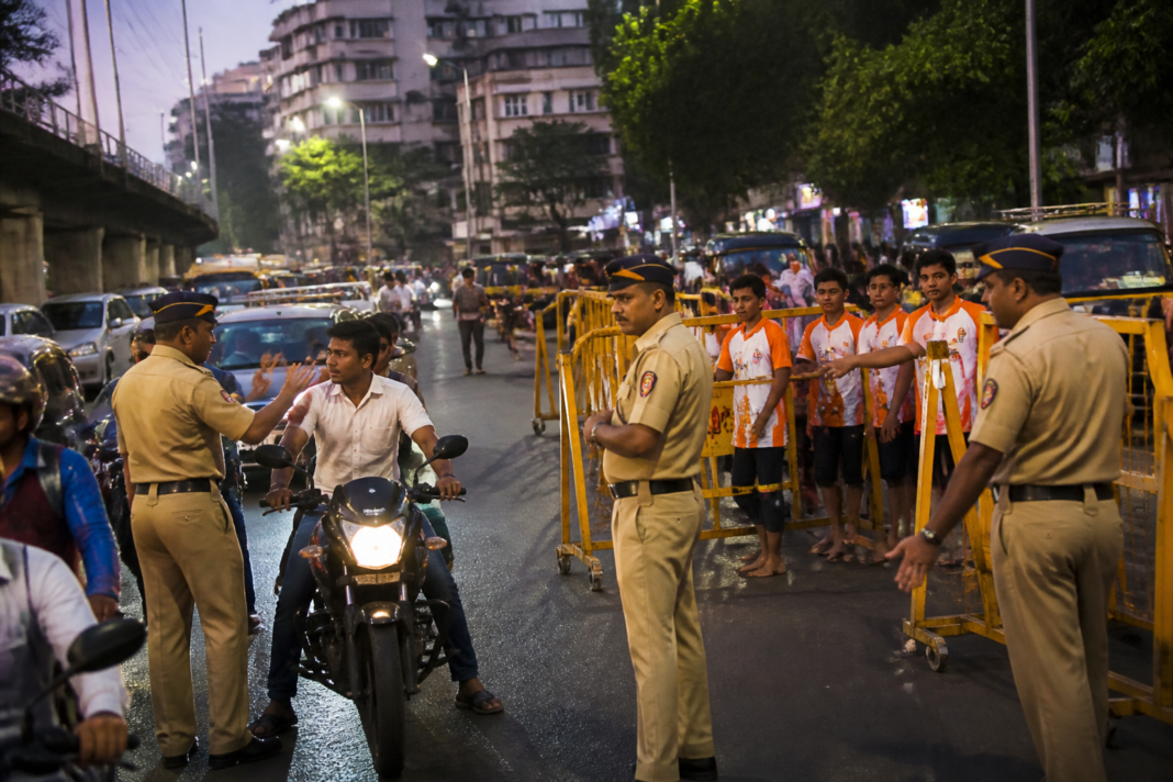 Mumbai traffic police stopping a two-wheeler during Dahi Handi traffic enforcement