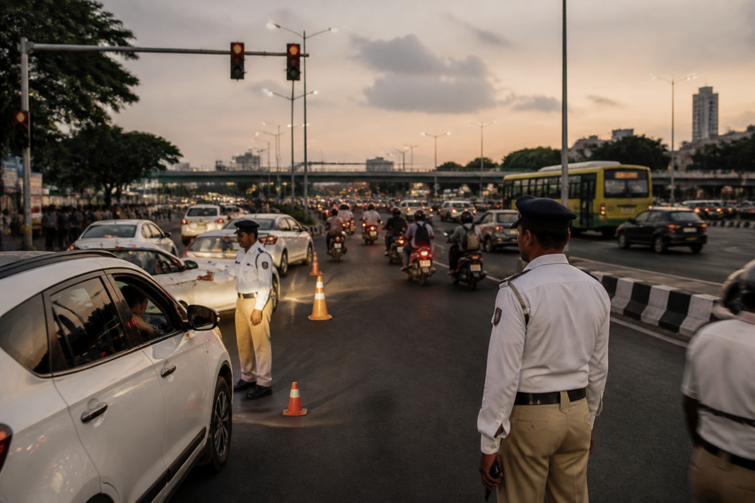 Traffic moving through an Indian city intersection, illustrating the proposed driving licence points system and road safety enforcement