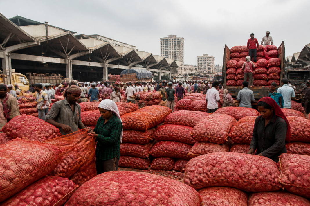 Workers and onion traders at Bengaluru’s Yeshwantpur APMC market yard