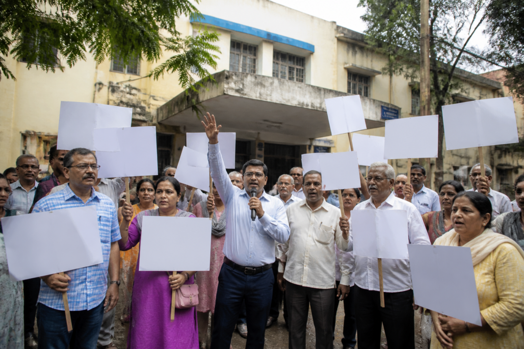 Residents protesting outside a Mahavitaran office during the Vasai smart meter protest