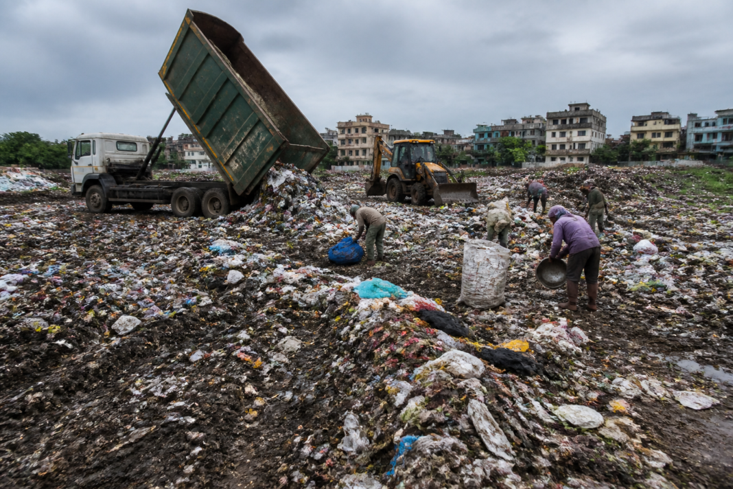 Waste accumulated at the Morekuran dumping ground in Palghar, where residents have complained of foul odour and flies