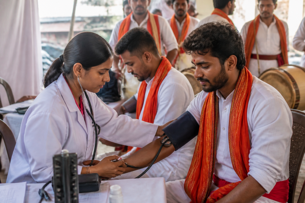 Dhol-tasha performers participating in a health screening campaign in Pune ahead of Ganeshotsav