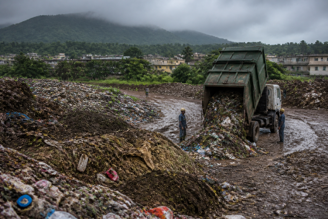 Waste accumulated at the Morekuran dumping ground in Palghar, where residents report foul odour and sewage-related sanitation concerns
