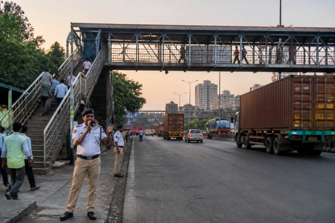 Traffic police conducting a pedestrian safety awareness drive beside the Mumbai-Ahmedabad Highway in Vasai