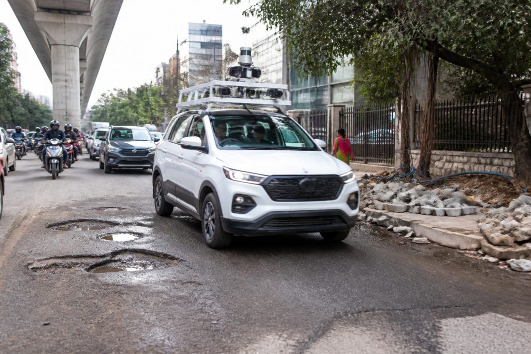 AI-enabled inspection vehicle surveying an urban road in Bengaluru for potholes and civic issues