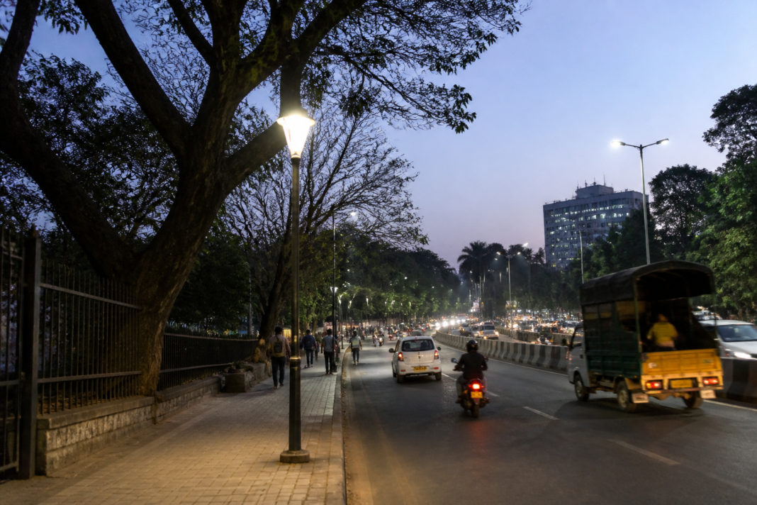 Street and footpath near Ulsoor Lake in Bengaluru showing urban civic infrastructure and streetlights