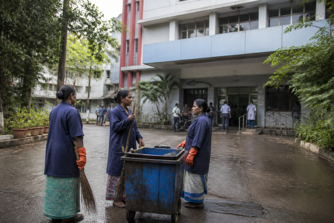 Sanitation workers outside Thane Mental Hospital after receiving minimum-wage arrears