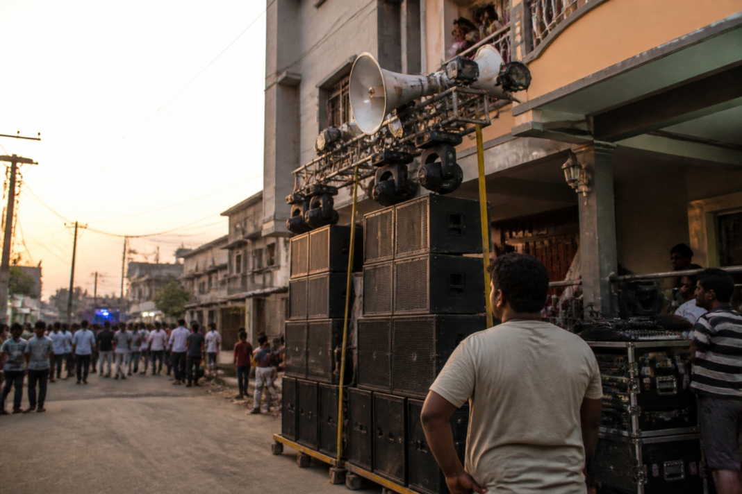 Loudspeakers and a DJ sound system set up at a public festival venue in Vasai