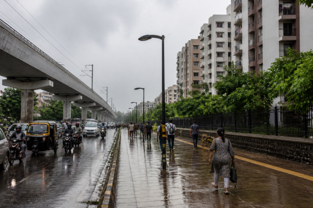 Urban road and residential neighbourhood in Pimpri-Chinchwad during the monsoon, representing rising swine flu and dengue cases