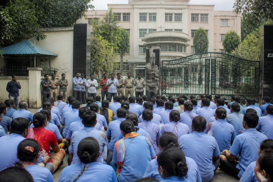 Sanitation workers outside Thane Mental Hospital during a labour rights protest over minimum wage dues