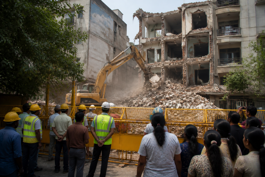 MCD-controlled demolition work at a building adjoining the collapsed Satya Niketan structure in south Delhi