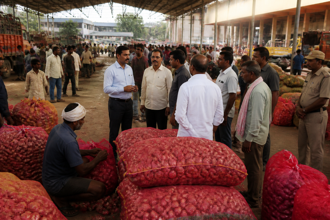 Workers and onion sacks inside Bengaluru's Yeshwanthpur APMC market during a reported visit by D.K. Shivakumar