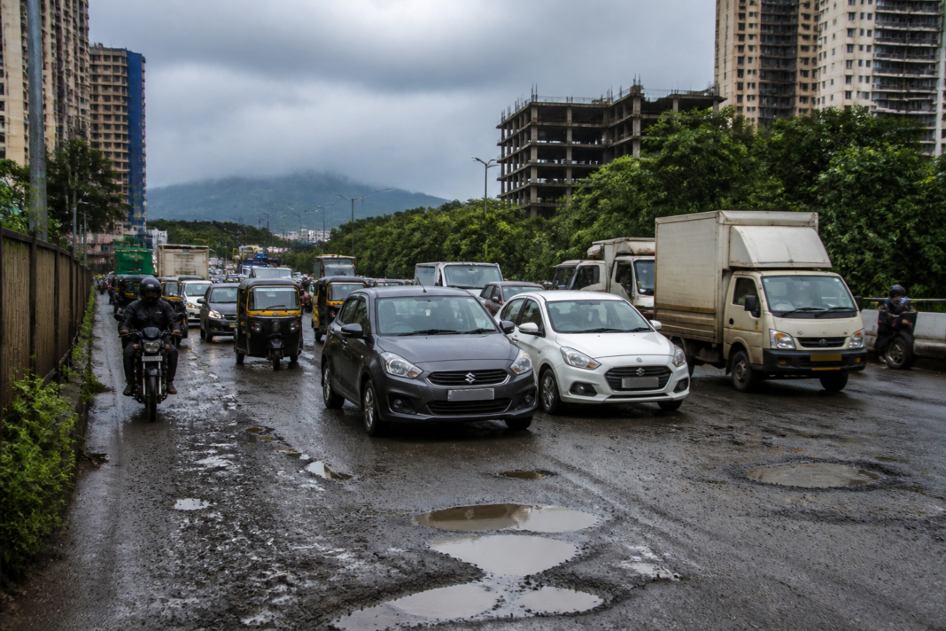 Traffic moving along the deteriorated Ghodbunder Road near Mira-Bhayandar before scheduled repairs