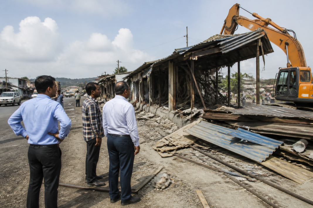 Revenue officials overseeing the demolition of unauthorised Roop Delta commercial units in Boisar, Palghar