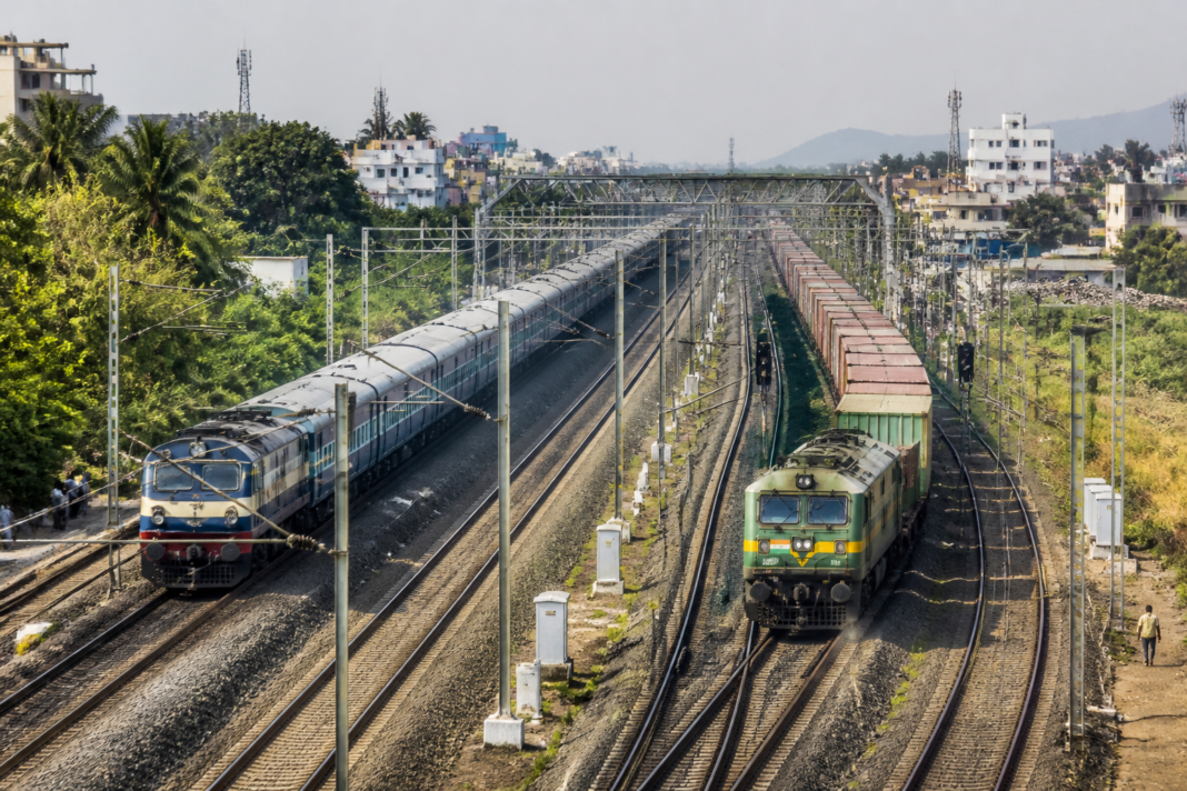 Railway tracks and overhead infrastructure representing Tamil Nadu rail projects near a busy Indian rail corridor