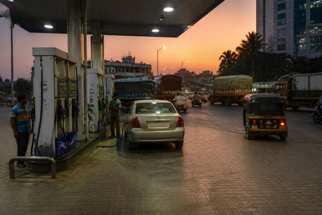 Fuel station in an Indian city with petrol and diesel price displays, representing rising crude oil prices in India