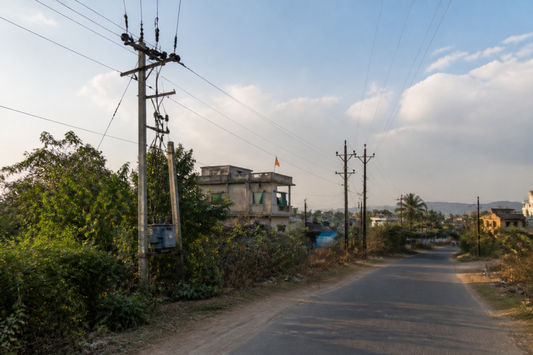 Electricity poles and overhead wires in a Thane district village linked to an electricity theft enforcement drive