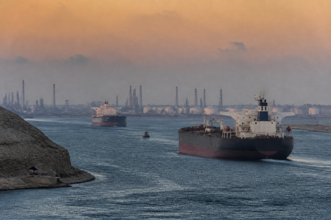 Oil tankers near a busy shipping route representing rising oil prices and risks to urban fuel supplies