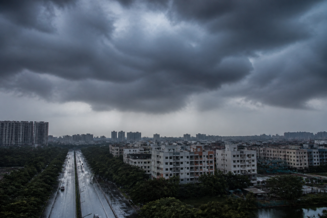 Cloudy Hyderabad skyline under monsoon rain and approaching thunderstorms