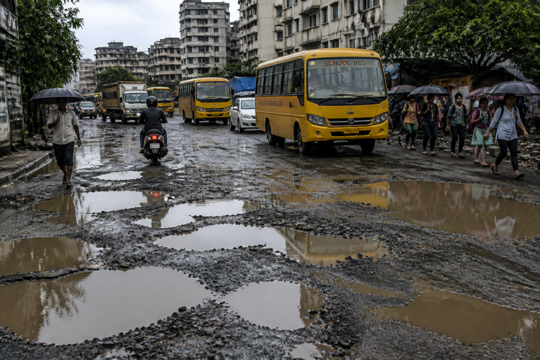 Kalyan road potholes on the waterlogged Gandharnagar road in Khadakpada