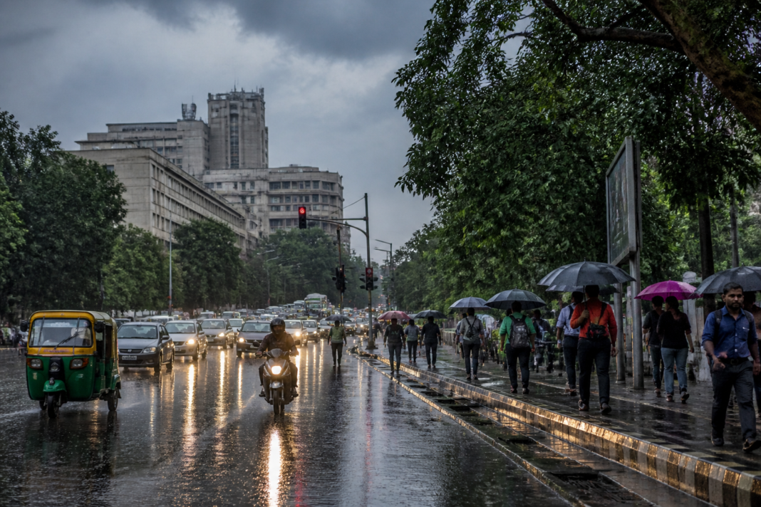 Delhi rain forecast showing a wet city street under monsoon clouds