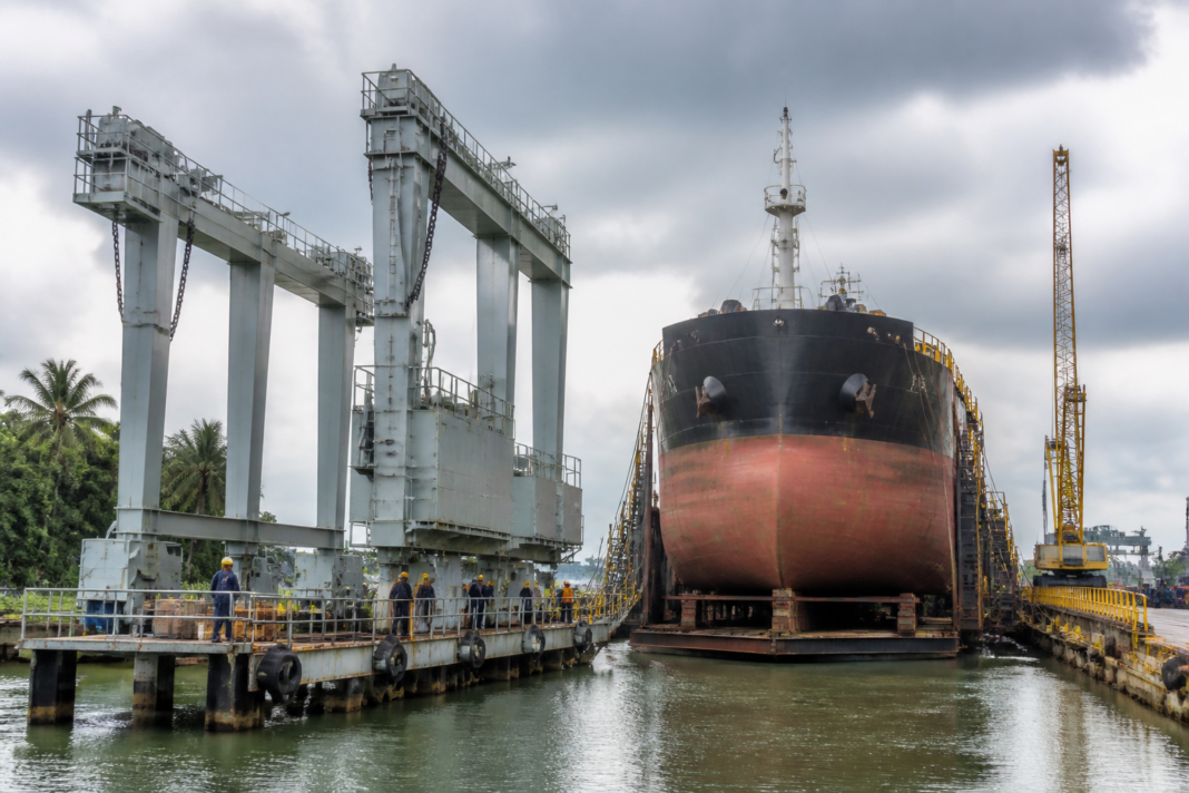 Kochi ship repair facility with a vessel positioned near modern docking infrastructure