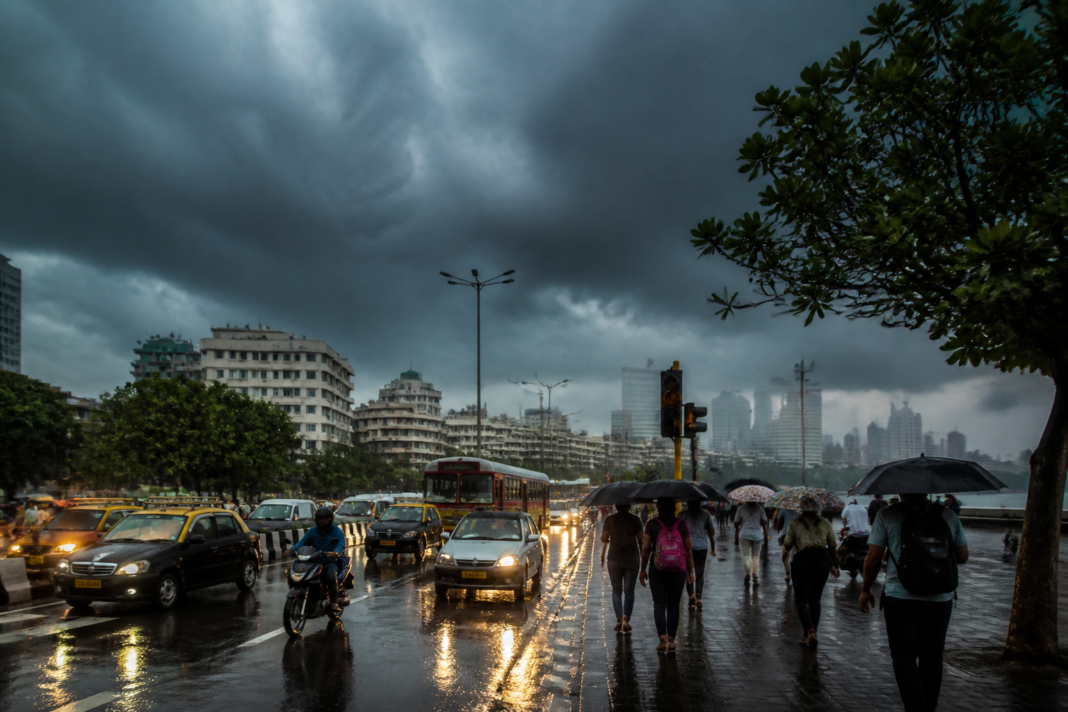 Mumbai weather alert during heavy rain over the city skyline and flooded urban roads