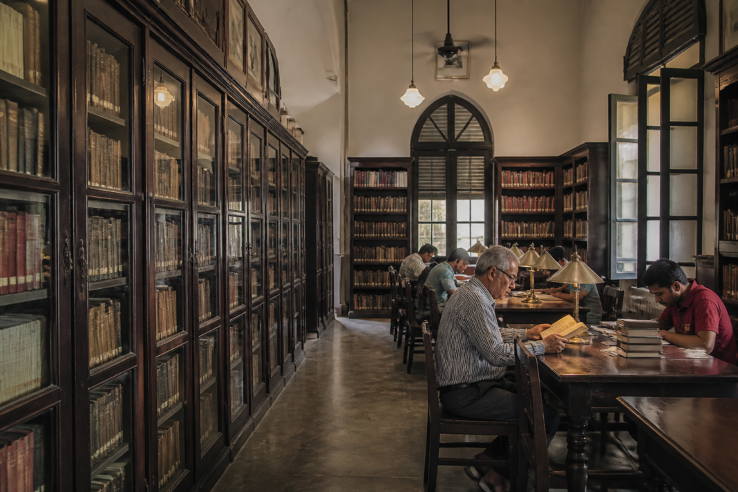 Mohammed Ali Library Kolkata reading room with restored wooden shelves and archival books