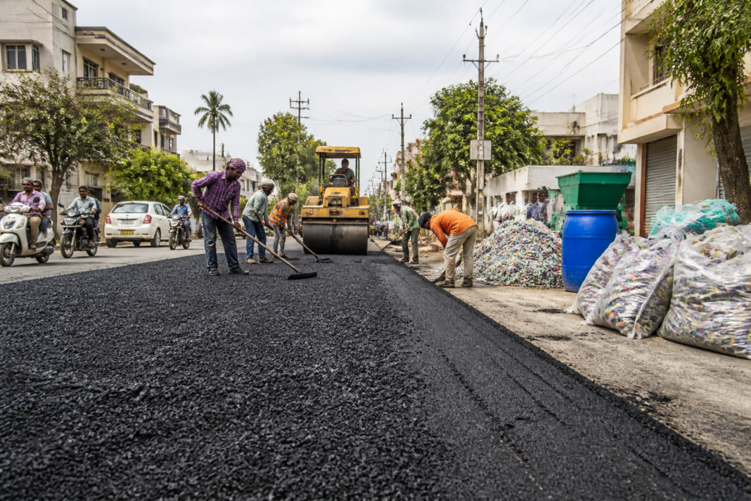 Plastic waste roads being laid on an urban street in Hubballi-Dharwad