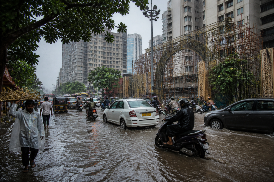 Thane rain causing waterlogging and traffic congestion near a city junction